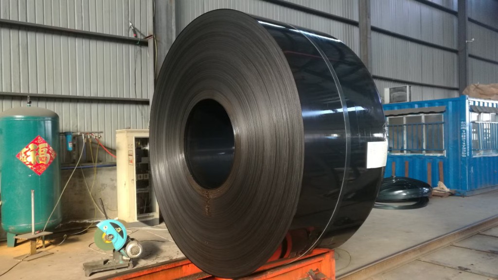 Single large black annealed cold rolled coil on stand